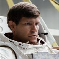 STS-38 Mission Specialist (MS) Carl J. Meade dons EMU in JSC's WETF Bldg 29 