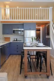 The L Shaped Kitchen Includes A Rolling Island Dining Table That Was Custom Built For The Space A Cookto In 2020 Small Kitchen Layouts Dining Room Small Kitchen Layout