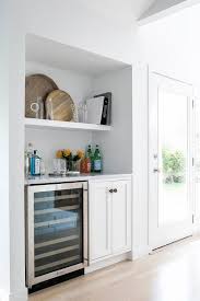 Bar with wine fridge opening. Glass Front Mini Bar Wine Fridge Design Ideas