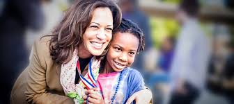 Young children carrying placards with photos of harris. Kamala Harris Has An Opportunity To Stand Up For Black Kids