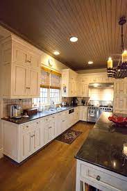Tall kitchen cabinets are a great solution for this but do not forget to place a ladder to. Note To Self Dark Bead Board Ceiling For Sunroom Lettered Cottage Blog Kitchen Design Wood Kitchen Kitchen Flooring