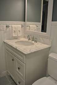 This beach style primary bathroom boasts a sink counter with two sinks along with a shower and tub combo. 7dd148a55bd8563cab44c0efcced55c3 Jpg 1 200 1 792 Pixels Condo Bathroom Beach House Bathroom Beadboard Bathroom