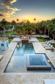 By Going With A Swimming Pool With Jacuzzi Design You Can Enjoy Your Yard All Year Long So Decide Backyard Pool Designs Backyard Pool Swimming Pools Backyard