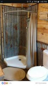 Exposed plumbing and corrugated metal walls in the open shower evoke a rustic sense of an outdoor shower. 24 Best Tin Shower Walls Ideas Rustic Bathrooms Rustic Bathroom Rustic House