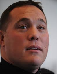 Officer broke woman's fall from building