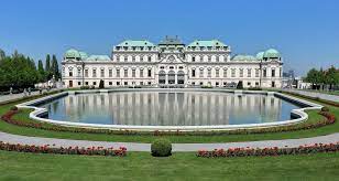 In front of the upper belvedere's outdoor steps, a large pool mirrors and duplicates the building's façade. Schloss Belvedere Wikipedia