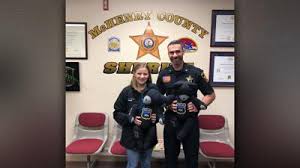 Sons of fallen officer Jacob Keltner given teddy bears made up in part of  their dads uniform