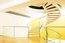 Metal spiral staircase covered in black paint, situated near the home's plastic table and chairs set. 50 Spiral Staircase Ideas Photos Home Stratosphere