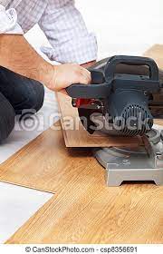 No other tool will cut laminate flooring lengthwise better than a tablesaw. Cutting Laminate Flooring Pieces With Electric Saw Closeup Canstock