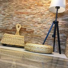 idee de decoration d interieur chez neptuno carrelages a la louviere dans le hainaut au mur sont placee des briquettes de bois naturel tercocer et au sol un ca