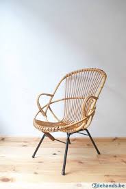 rotan rieten stoel stoeltje met hoge rug uit rotan vervaardigd met zwart metalen onderstel rohe noordwolde elegant vintag rieten stoelen stoelen meubels