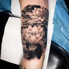 A lily flower tattoo usually looks good in small size but you can try it in large sizes too. The Top 35 Water Lily Tattoo Ideas 2021 Inspiration Guide