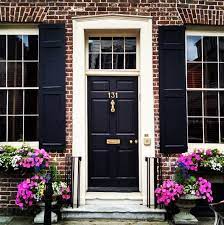 A brick house with a blue door and black shutters classy door color for red brick house with black shutters. Our Favorite Charleston Front Doors Exterior House Colors Exterior Brick Brick Exterior House