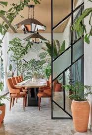 Restaurant Resembling A Conservatory Minnie Bhatt Design The Architects Diary Tropical Interior Design Tropical Dining Room Modern Tropical House