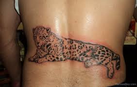 Bud on lower lower back tattoo design. Realistic Sitting Jaguar Tattoo On Lower Back For Men