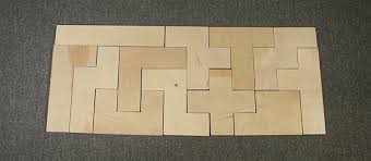 Place two pieces with left and right notches, so the notches face upward. Math Monday Pentominoes National Museum Of Mathematics