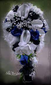 Faux wedding bouquets in navy blue flowers and eucalyptus greenery. Love This Black White Royal Blue Bridal Bouquet Calla Lilies White Bridal Bouquet Bridal Bouquet Flowers Silk Flowers Wedding