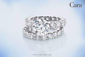 A Glamorous Bridal Set Is Illuminated With Pave Diamonds That Highlight The Central Round Diamond Carajewellers Eu Lo Pave Diamonds Wedding Rings Diamond