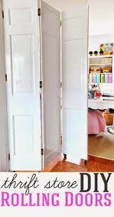 How To Make Diy Rolling Doors With Thrift Store Bifold Doors No Fancy Or Expensive Hardware Needed Room Divider Doors Diy Room Divider Room Diy