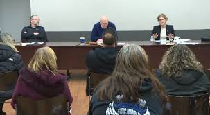 Grass vs. turf football field debate at Sharon High School