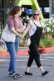 The actress revealed her pregnancy in w magazine's directors issue and showed her growing baby bump — in couture, no less — on the cover. Kirsten Dunst Covers Her Baby Bump In Overalls People Com