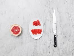 With a sharp knife, slice along sides of membranes to separate segments. How To Cut A Grapefruit Recipe With Video Kitchen Stories