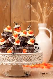 Check spelling or type a new query. Halloween Chocolate Muffins On Cake Stand With Homemade Fondant Pumpkins Stock Photo Picture And Royalty Free Image Image 10756202