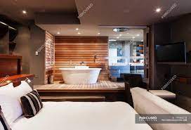 Maybe you would like to learn more about one of these? Bed And Bathtub In Modern Master Bedroom Property Residential Stock Photo 199866218