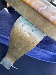 Hello! I've acquired this onyx and brass table that is solid but with a  worn finish ( the stone is dull and remnants of a sealant are still present  along the beveled