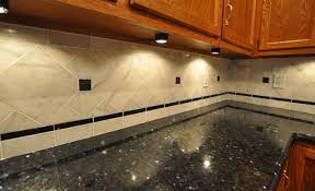 Ella™ countertops paired with a white herringbone tile backsplash Granite Countertops And Tile Backsplash Ideas Eclectic Kitchen Indianapolis By Supreme Surface Inc Houzz