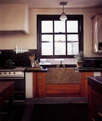 I'm getting ready to install a tile backsplash in the kitchen between the counter and cabinets. Black Window