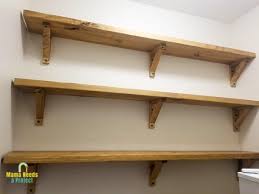 You can see the brackets underneath the top shelf in the picture below. Diy Wood Shelf Brackets For Open Shelving Mama Needs A Project