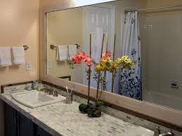 $122 for a 36″ x 24″ mirror with six clips. Add A Wood Frame Around A Plain Mirror Diy