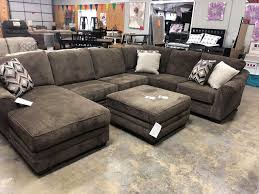 With A Roomy L Shaped Sectional Thanks To Curly S Make The Most Of Your Floor Space Sectional Sectional Ottoman Leather Sofa