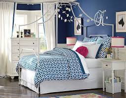 The decorative pink and blue puff balls work for a great decorative accent in the room. Navy Blue Bedroom For Girls Architecture Home Decor