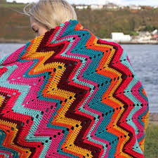 Forget the grey and black and just take your colorful yarns to add some positive energy to the room. Crochet Chevron Retro Blanket Pattern Annie Design Crochet