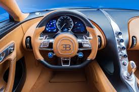 Soft leather surrounds its purist dashboard. Bugatti Chiron Interior Steering Wheel Car Body Design