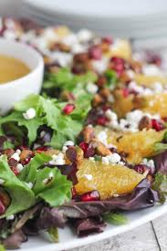 Christmas eve dinner just got easier. This Christmas Salad With Goat Cheese Pomegranate Arils Crunchy Pistachios And Juicy Orange Slic Gourmet Salad Christmas Salad Recipes Champagne Vinaigrette