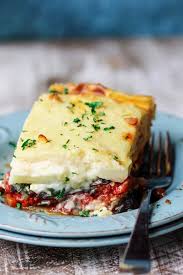 It includes sliced eggplant baked in a ground beef sauce and then smothered in a thin white sauce. Vegetarian Moussaka Classic Greek Casserole Eating European