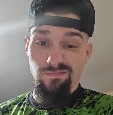 Cleaning flower beds in Watkins village