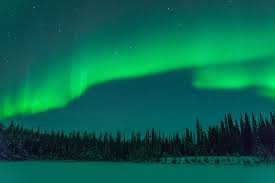 Caused by supercharged solar particles colliding with the earth's atmosphere, these ethereal streamers of green, white, purple, blue and even red light draw awestruck travelers from all over the world. How To See The Northern Lights In Alaska From Home Best Webcams Bloomberg