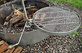 This adjustable fire pit grill grate might be one of our favorite options, due to the dual cooking surfaces, but it loses a few points for needing to be staked into the ground (not great for patio fire pits), and for having a much smaller cooking area than our first two options. Swivel Grills Grates