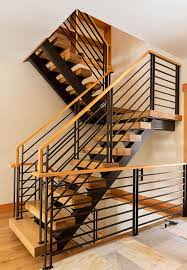 Rustic Modern Wood And Black Metal Staircase By Phinney Design Group Photo By Elizabeth Pedinotti Haynes Stair Railing Design Railing Design Staircase Design