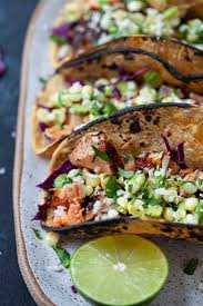 Remove the fish from the heat, and if desired, warm the tortillas in the same skillet over medium heat, cooking for about 30 seconds on each side. Blackened Salmon Tacos With Corn Avocado Salsa The Foodie Dietitian Kara Lydon