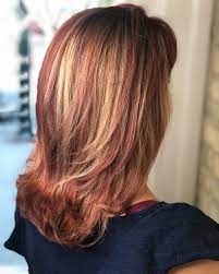 This is a dark red base with lighter red highlights throughout. 20 Hottest Red Hair With Blonde Highlights For 2021