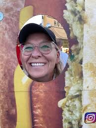 Person eating hotdog at chaparral park