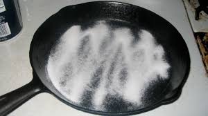 Clean Cast Iron And Carbon Steel Cookware With A Salt Scrub Cast Iron Cleaning Reseason Cast Iron Cleaning Cast Iron Pans