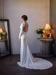 Whether you prefer to keep it modest with a boat neckline or you'd dare to show some skin, these satin gowns will keep the guests talking for months. Mermaid Simple White Long Sleeves Backless Wedding Dresses Wd0446 Romanbridal