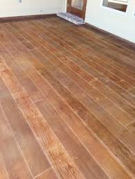 I Really Like The Wood Looking Painted Stained Concrete Would Like To Do This If It S Not T Painted Concrete Floors Concrete Stained Floors Painting Concrete
