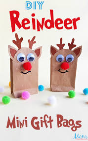 It's a fun gift bag to hold homemade baked goods, candy, small gifts etc. Diy Reindeer Gift Bags A Fun Christmas Craft Mom Does Reviews